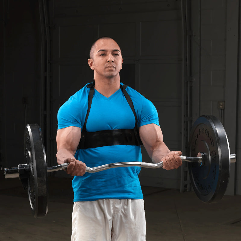 Man lifting a barbell in a gym setting