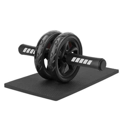 Black ab roller on a black mat with white background