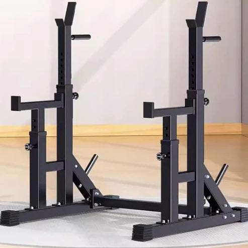 Black weight lifting rack on a wooden floor with a white wall background