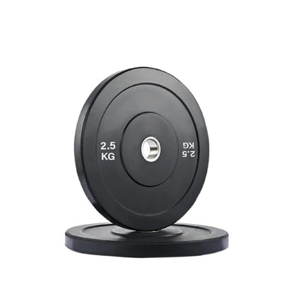 Black weight plate with '2.5 KG' marking on a white background