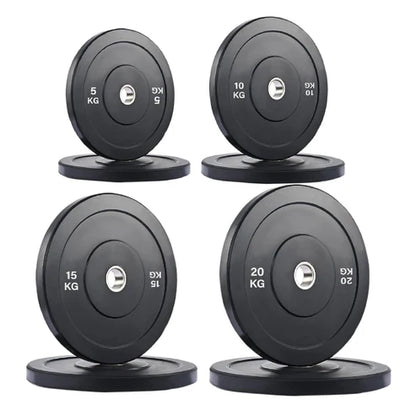 Set of four black weight plates with labeled weights on a white background