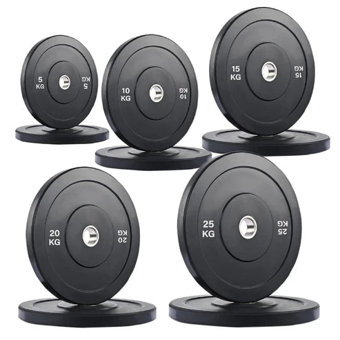 Set of weight plates with labeled weights on a white background