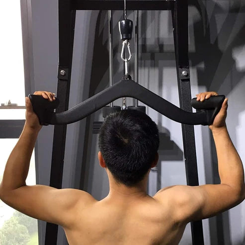 Person using a cable machine in a gym setting