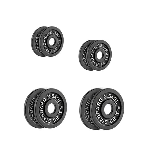 Two black weight plates with measurement markings on a white background