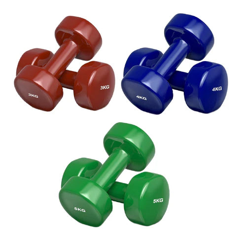 Set of red, blue, and green dumbbells with weight markings on a white background