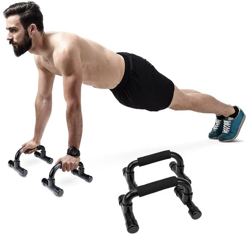 Man performing push-ups with black push-up stands on a white background