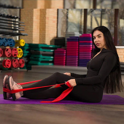 Woman exercising with resistance bands in a gym setting