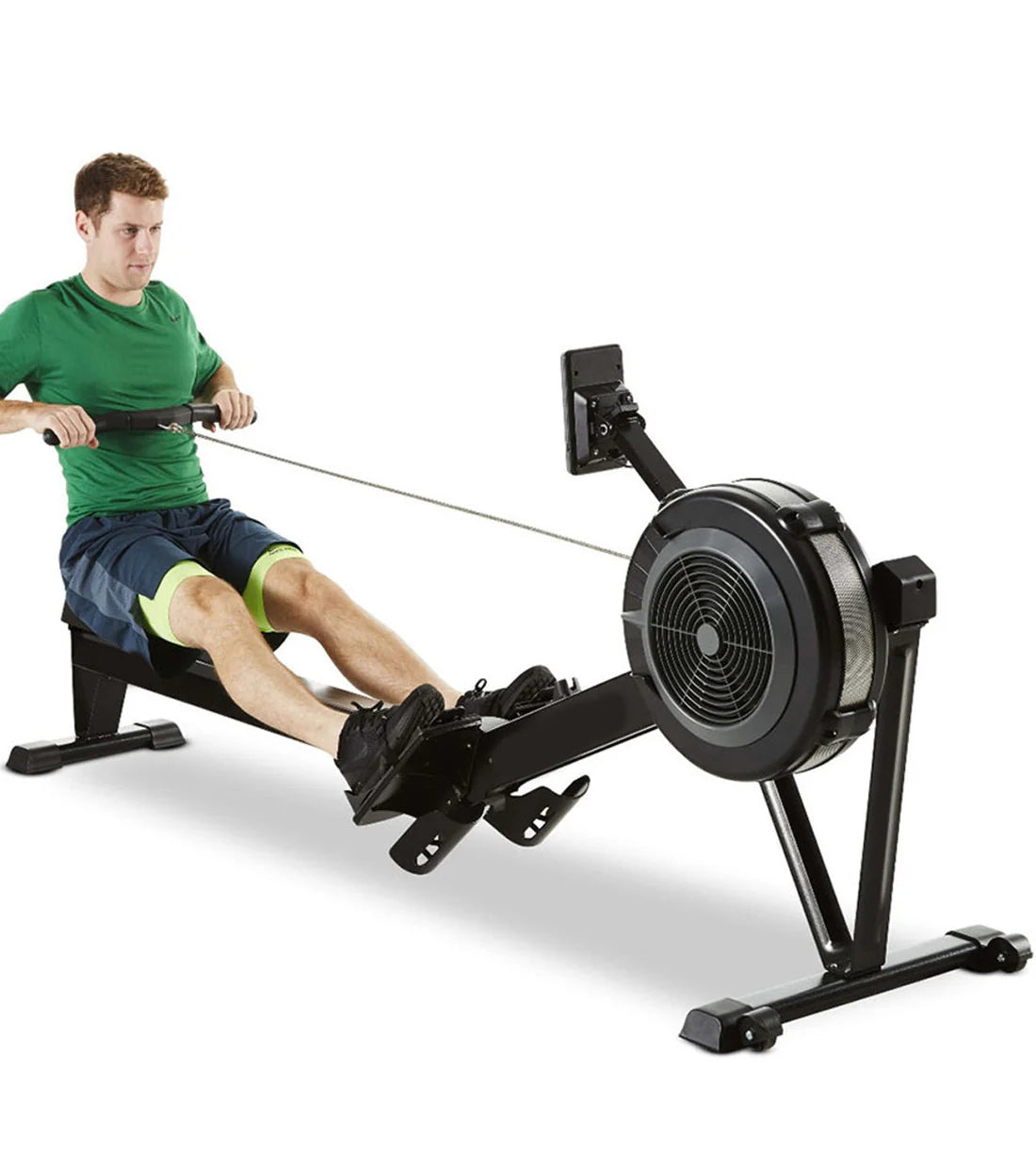Man using a rowing machine on a white background