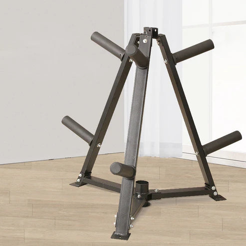 Black weight lifting stand on a wooden floor with a white wall background