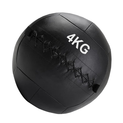 Black medicine ball with '4KG' marking on a white background