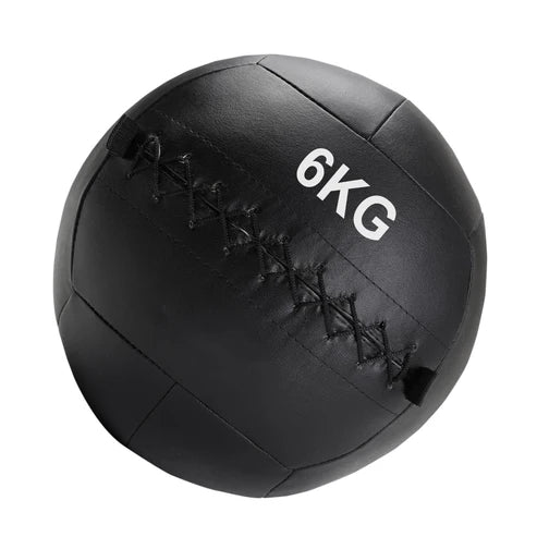 Black medicine ball with '4KG' marking on a white background