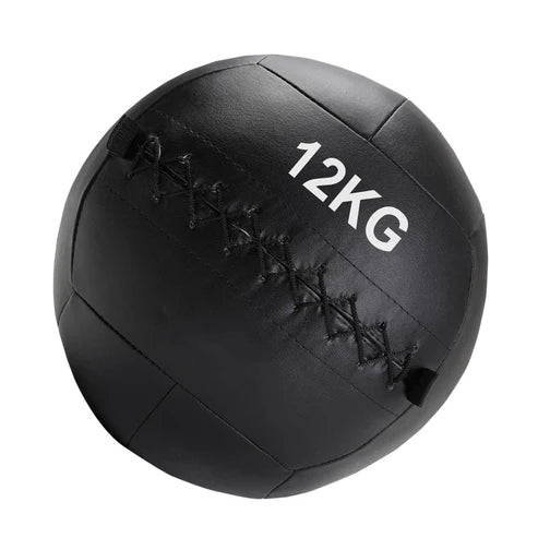 Black medicine ball with '12KG' marking on a white background