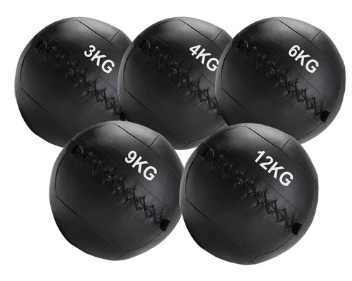Set of five black weighted medicine balls with labeled weights on a white background