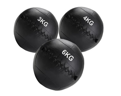 Three black weighted medicine balls with weight markings on a white background
