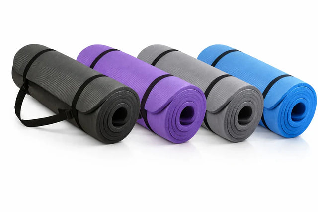 Four yoga mats in black, purple, gray, and blue on a white background